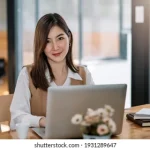 charming-asian-woman-working-office-260nw-1931289647